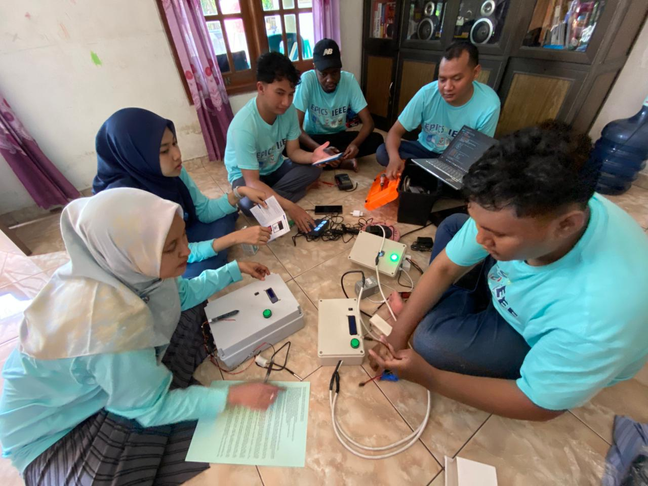 EPICS in IEEE team members testing IoT equipment and connected monitoring components during project development.